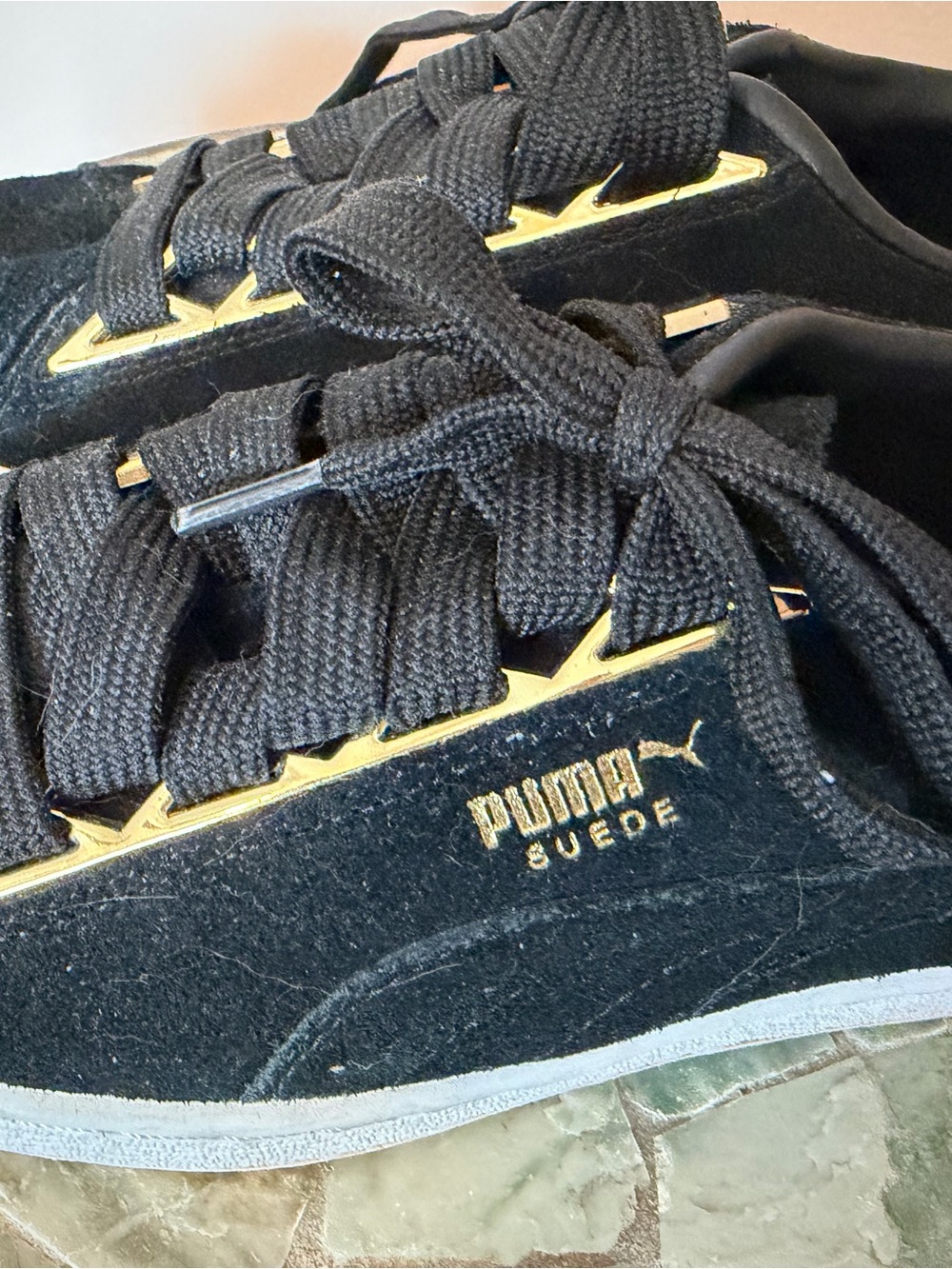 Puma Suede Women's Sneakers in Black with Gold Accents